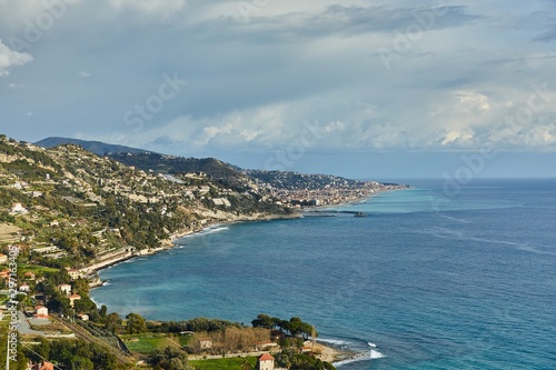 Mediterranean coastal landscape in Northern Italy Riviera, view of Ventimigla, town by the French border