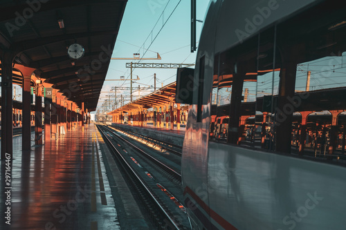 Travel by train concept. Empty station with train ready to leave. Sunset Autumn Light. Madrid, Spain.