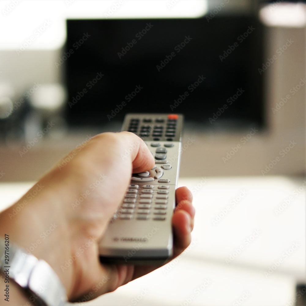 male hand using remote control