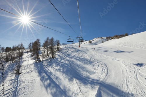 Using ski lift in the Alps