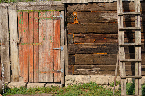Old wooden barn. Old building. Old wooden doors.