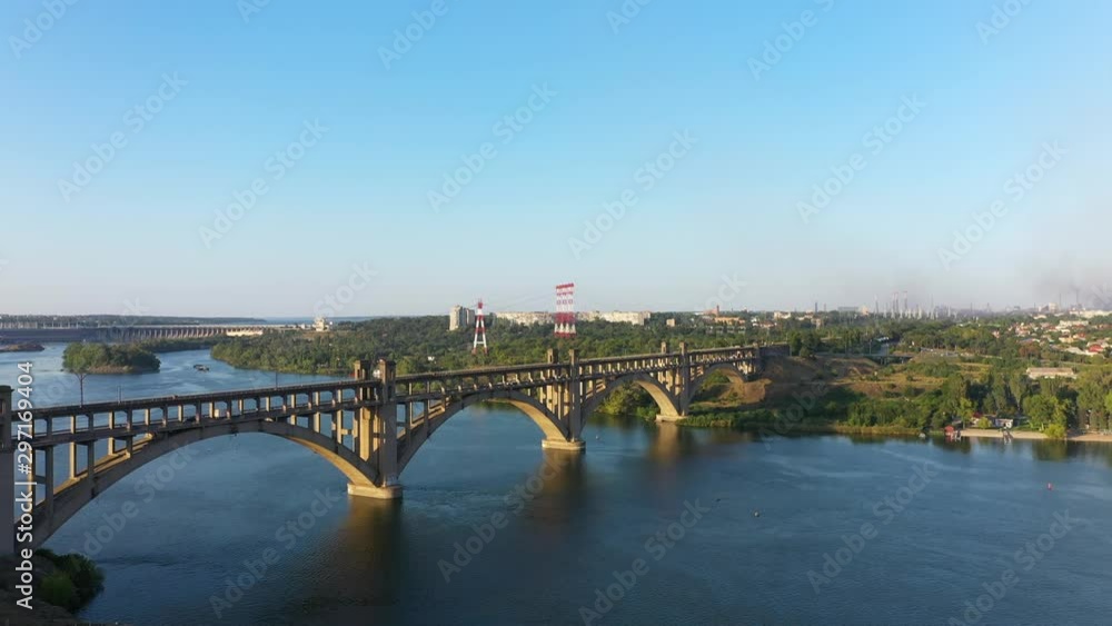 Arch Bridge in the Background of Industrial City. Camera movement from bottom top. Arch Bridge in the Background of Industrial City. Camera movement from bottom top.