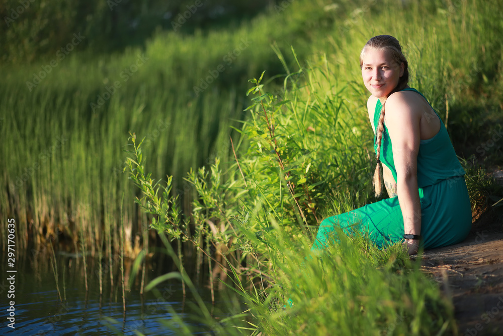 Pregnant girl in a field with lupines Pregnant girl in a field with lupines