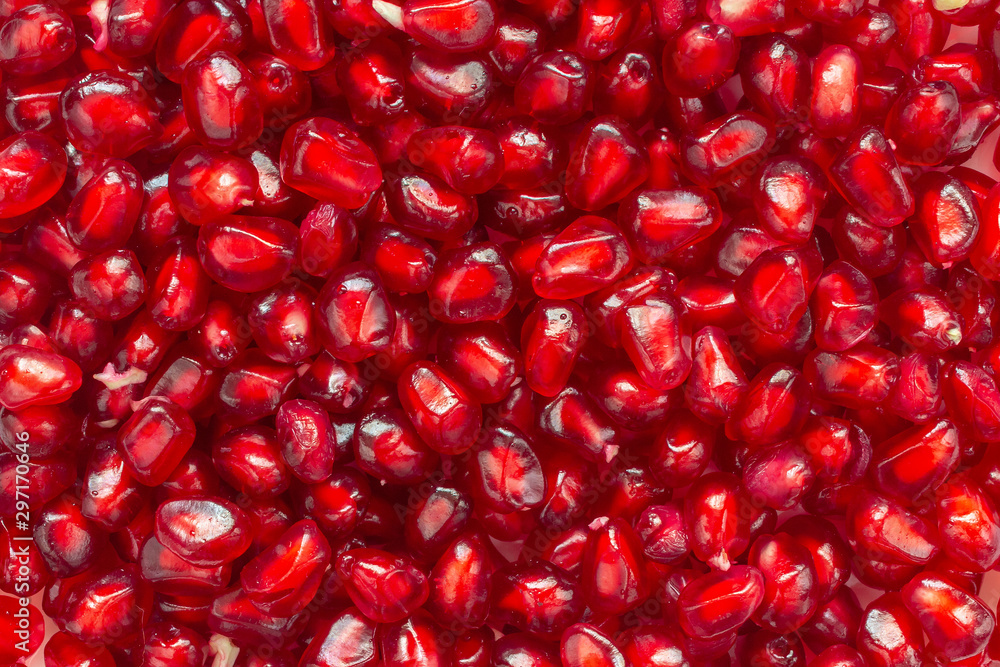 Background of peeled, moist, red pomegranate seeds Background of peeled, moist, red pomegranate seeds