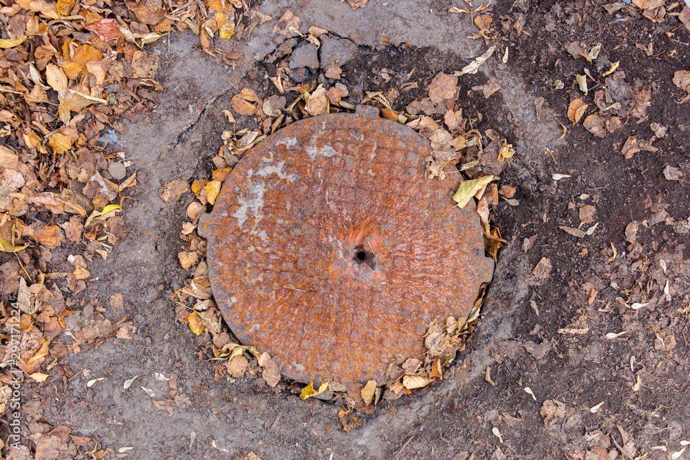 Fototapeta premium old rusty sewer manhole, texture