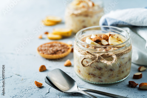 Banana flax seeds overnight oats with banana slices and almonds photo