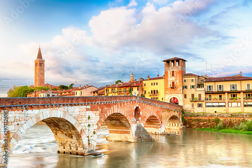 Famous Verona landmark. Ponte di Pietra over Adige river during sunrise in Verona, Italy