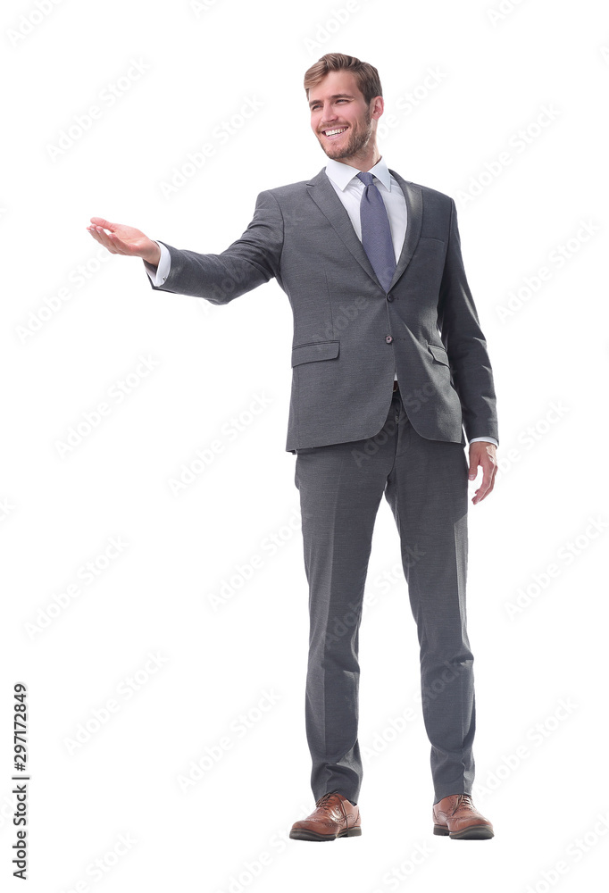 in full growth. businessman with a hand in a welcoming gesture. in full growth. businessman with a hand in a welcoming gesture.