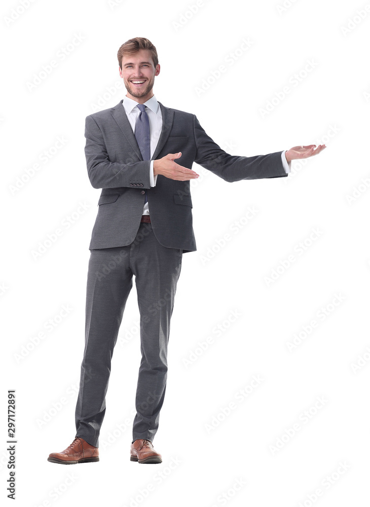 in full growth. businessman with a hand in a welcoming gesture. in full growth. businessman with a hand in a welcoming gesture.