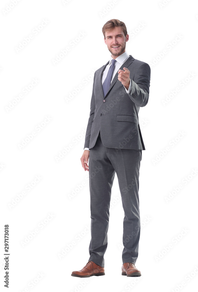 in full growth. smiling businessman pointing at you. in full growth. smiling businessman pointing at you.