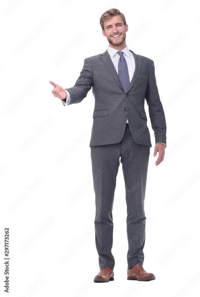 in full growth. handsome businessman extending his hand for a handshake. in full growth. handsome businessman extending his hand for a handshake.