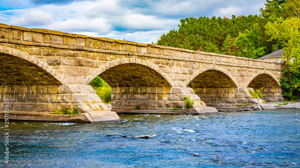 Arched Stone Bridge Over a River