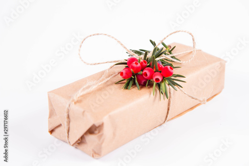 Gift decorated with a gunny string bow and with a common yew twig 