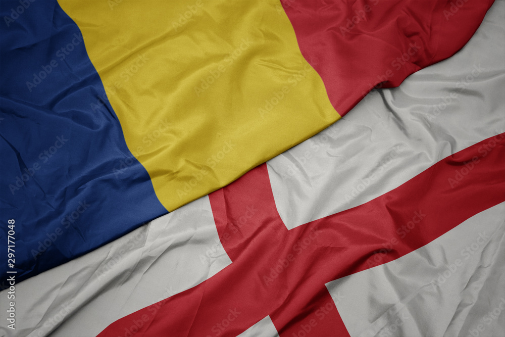 waving colorful flag of england and national flag of romania.