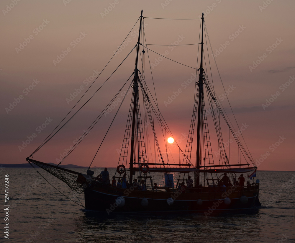 Sailboat at Sunset in Brac, Croatia. Scenic destination in the Adriatic Sea. 