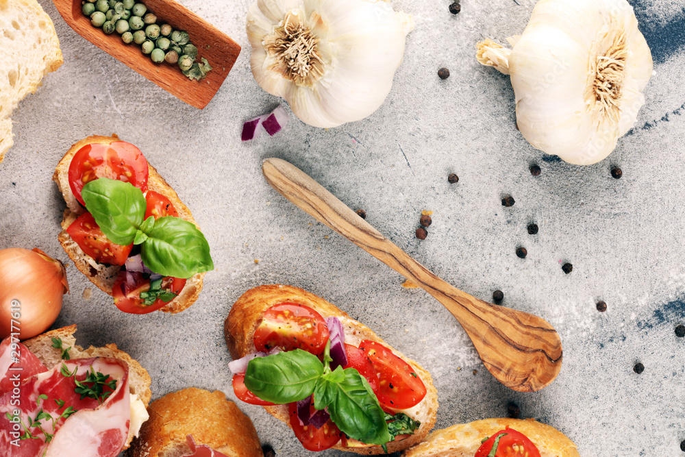 Assorted bruschetta with various toppings. Appetizing bruschetta or crudo crostini. Variety of small sandwiches. Mix bruschetta on table Assorted bruschetta with various toppings. Appetizing bruschetta or crudo crostini. Variety of small sandwiches. Mix bruschetta on table