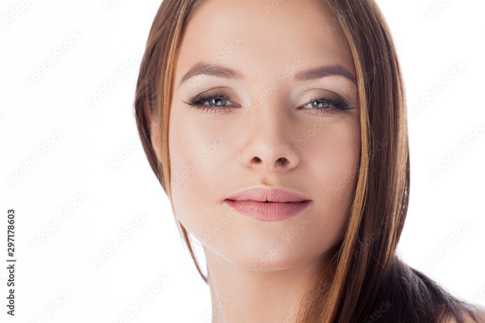 Skin care. The girl touches her face, close-up. Portrait of young beautiful woman with smooth and healthy skin Skin care. The girl touches her face, close-up. Portrait of young beautiful woman with smooth and healthy skin