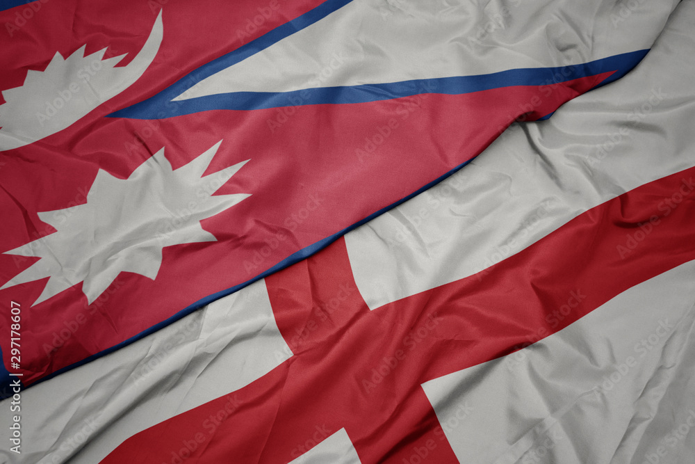 waving colorful flag of england and national flag of nepal.