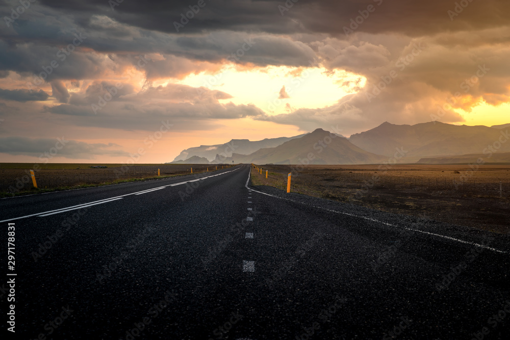 Typical icelandic landscape with empty road and scenic nature.