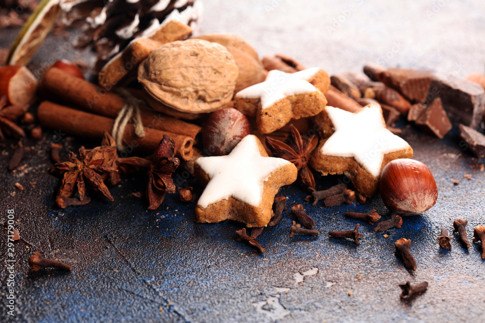 Baking christmas cookies. Typical cinnamon stars bakery with spices. xmas decoration on table Baking christmas cookies. Typical cinnamon stars bakery with spices. xmas decoration on table