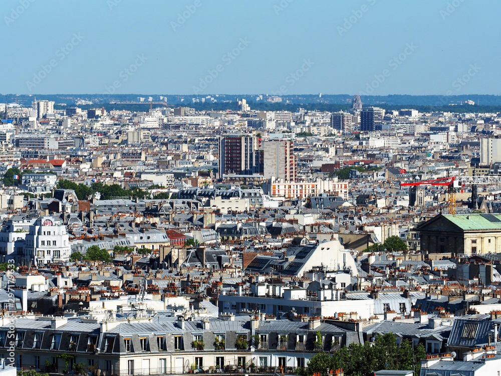 Aerial cityscape of Paris in France, Montmartre. View of Paris from Sacre Coeur Basilica in France in summer day. Roofs in residential quarters