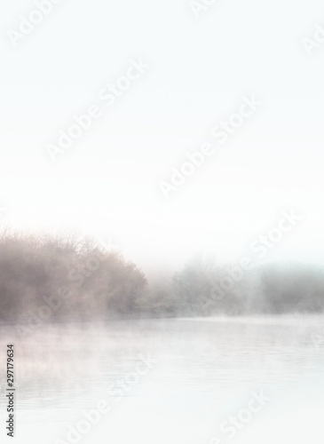 Dawn. Autumn foggy lake. Beauty nature background