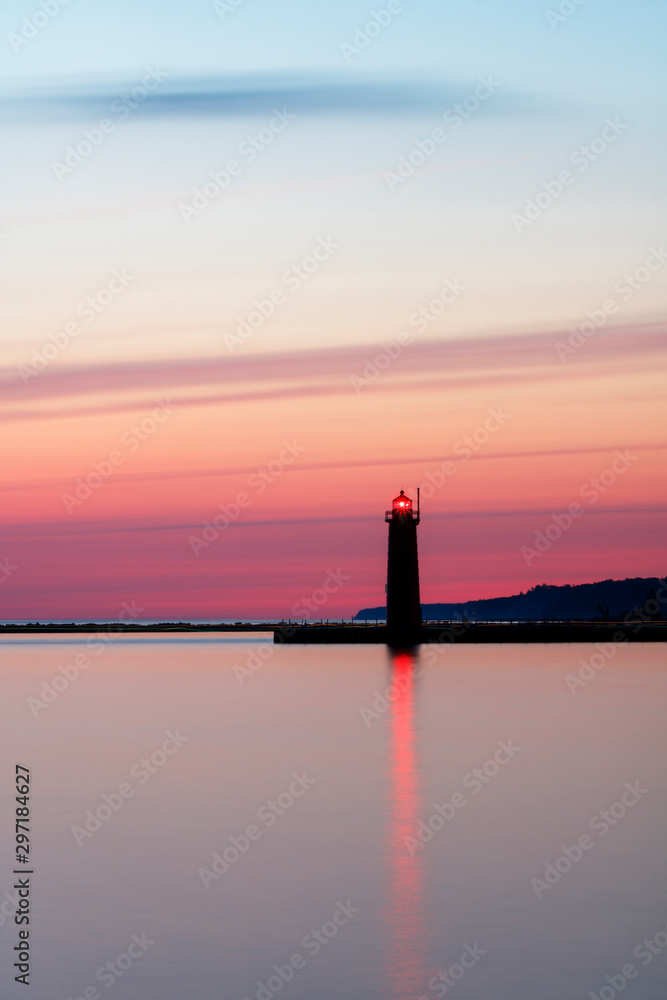 lighthouse at sunset with pastels
