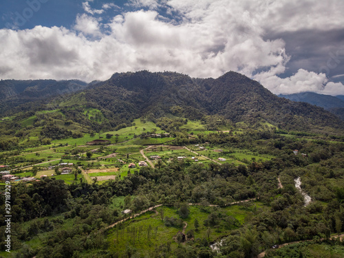 Amazing panoramic view of Bella Vista valley. You can see several mountains, hills, wild vegetation and the sky full of clouds. Mindo, EcuadorPanoramic view from Mindo Valley, Ecuador.