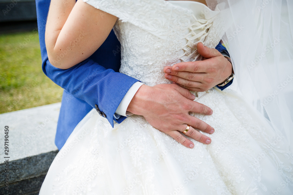 gold wedding rings in the hands of the newlyweds gold wedding rings in the hands of the newlyweds