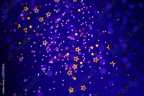 Star-shaped confetti on blue background.