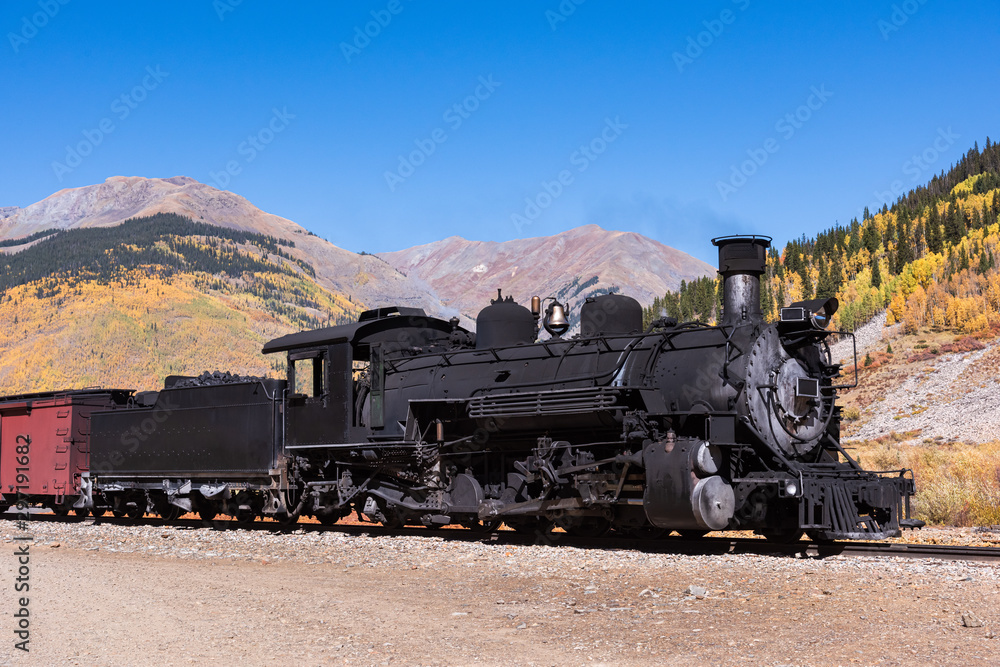 Obraz premium Vintage Steam Train With Autumn Scenery Background.