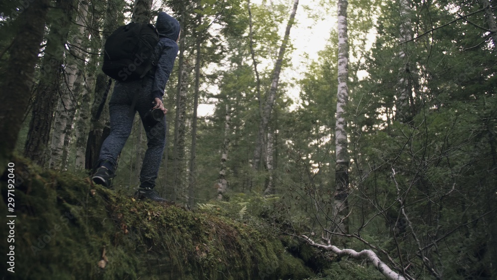 Traveler photographing scenic view in forest. One caucasian woman shooting nice magic look. Girl take photo video on dslr mirrorless camera. Traveler photographing scenic view in forest. One caucasian woman shooting nice magic look. Girl take photo video on dslr mirrorless camera.