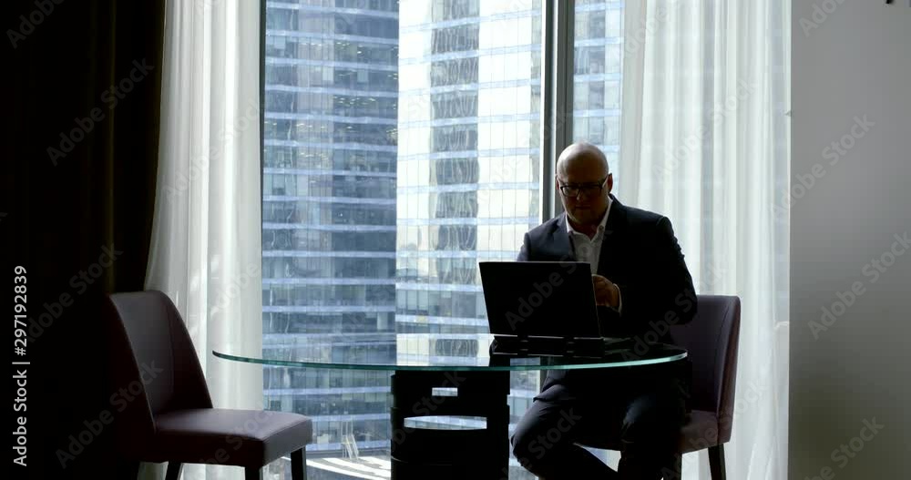 businessman works on laptop at table in office slow motion businessman works on laptop at table in office slow motion