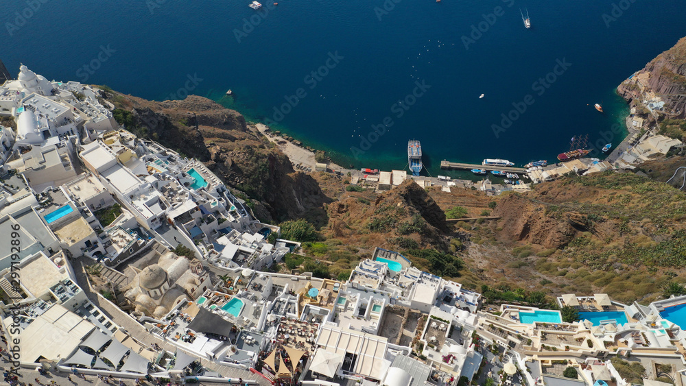Aerial drone photo of Fira main village of Santorini island with breathtaking views to Caldera and Aegean sea, Cyclades, Greece