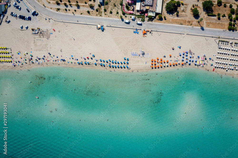 Aerial view of San Vito Lo Capo,Sicily white sand beach. Sun loungers, umbrellas and the sea, view from a quadrocopter