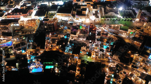 Aerial night shot of iconic village of Fira built on top of cliff, Santorini island, Cyclades, Greece