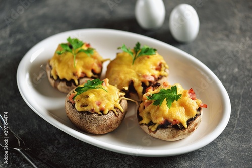 Stuffed mushrooms with smoked meat, fried onions and hard cheese.