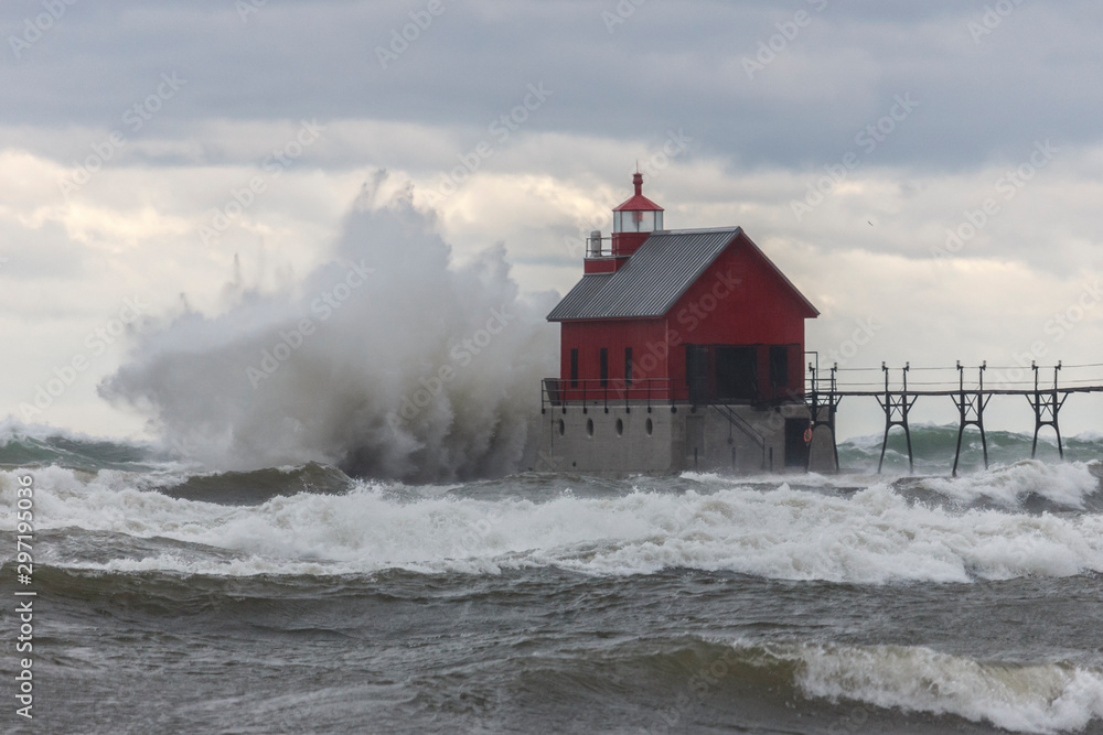 big waves hitting lighthouse