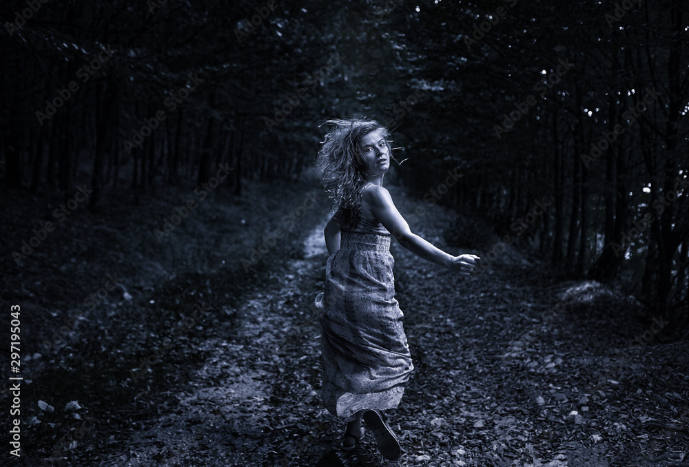 Scared girl running through forest Stock Photo Adobe Stock