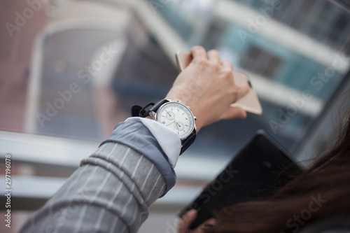 Business woman looking at the clock, close-up,