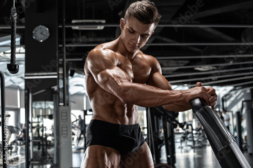 Muscular man workout in gym, strong male naked torso abs © nikolas_jkd