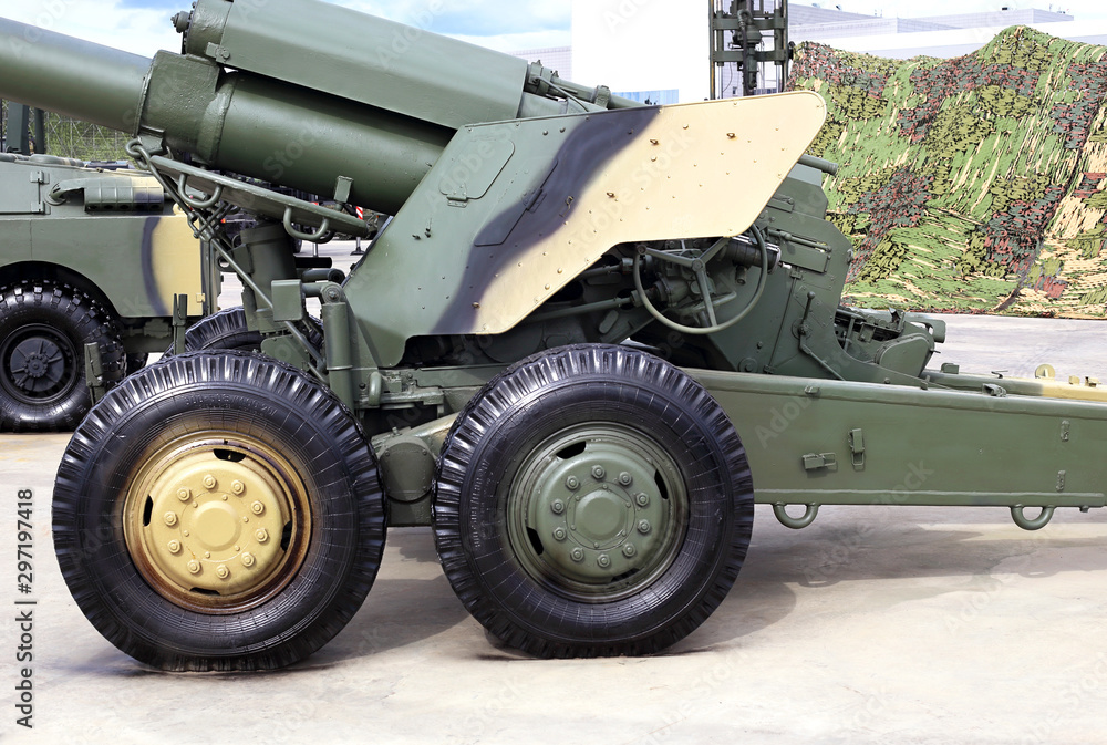 Howitzer with a raised gun, side view Howitzer with a raised gun, side view