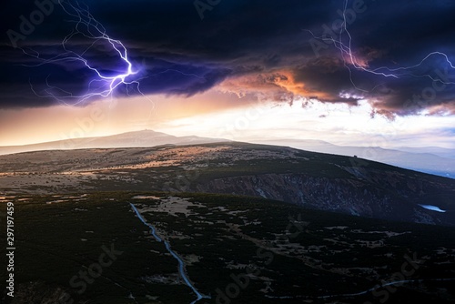 Stormy sky, lightning, mountain . Cloud landscape. Dramatic sunset