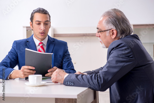 Two businessman discussing business in office © Elnur