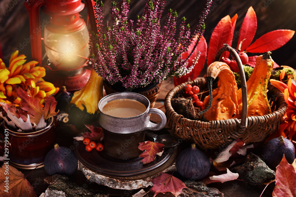 autumn decoration and cup of coffee