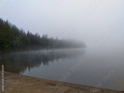 View of Lac Wapizagonke on morning fog from the lookout La Mauricie National Park. View of the lake on a cold day.- Black and White. Quebec. Canada