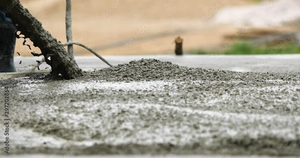 Work industrial concept : Pouring and sweep the wet cement on the floor in process of house building