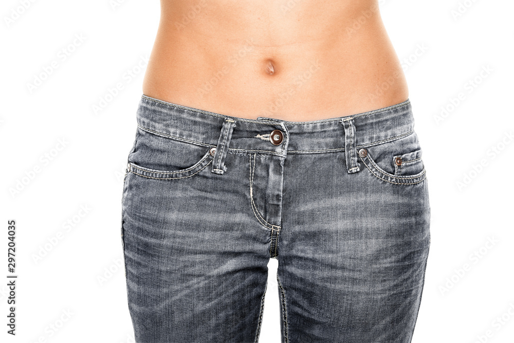 Woman waist wearing jeans. Weight loss stomach closeup. Skinny jeans on a  healthy slim fit body. Stock Photo | Adobe Stock