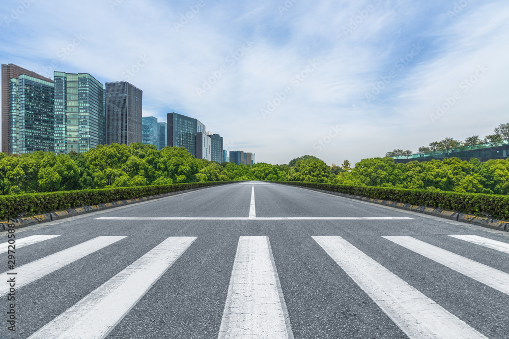 empty road with zebra crossing and skyscrapers in modern city. empty road with zebra crossing and skyscrapers in modern city.