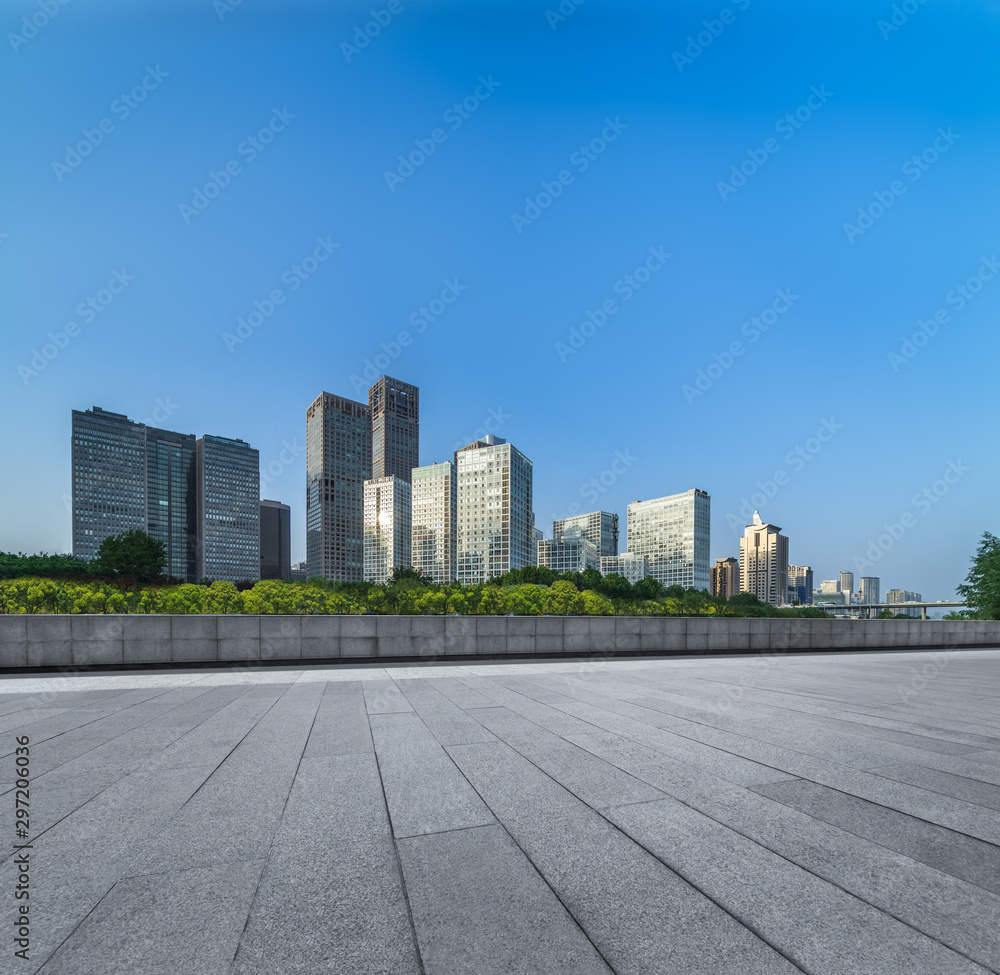 Empty city square road and modern business district office buildings in Beijing, China